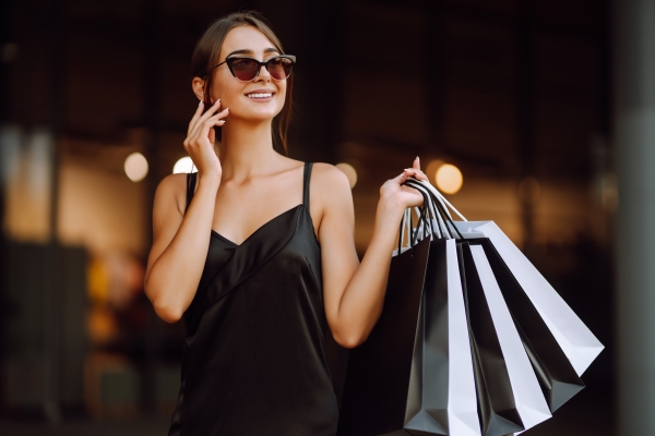 Fashionable Woman Dressed in Black Shopping